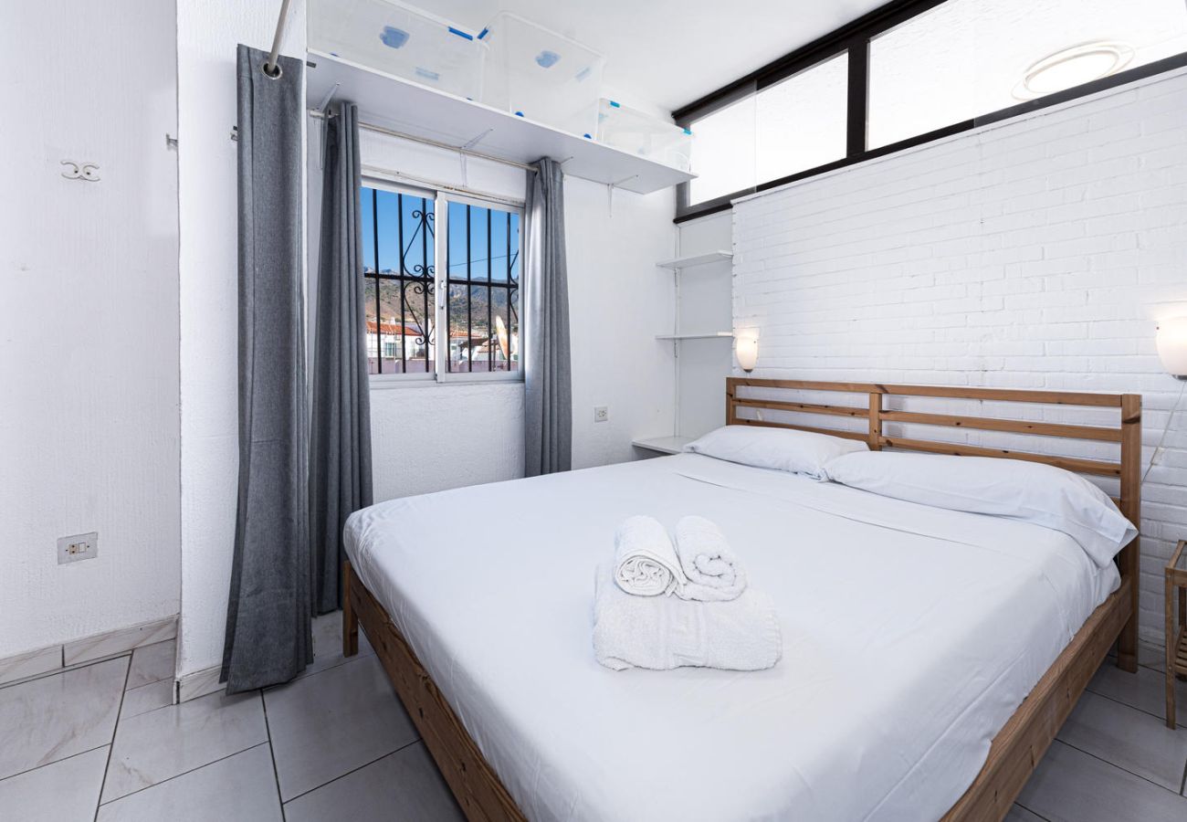 Master bedroom with double bed and professional linen.