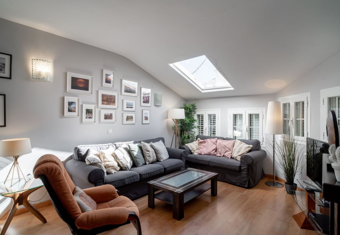 Spacious living room with AC and sofas in Nerja holiday rental house