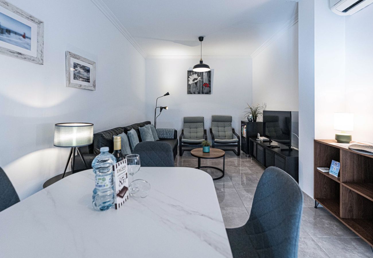 Modern renovated living room in Nerja apartment near Torrecilla Beach.