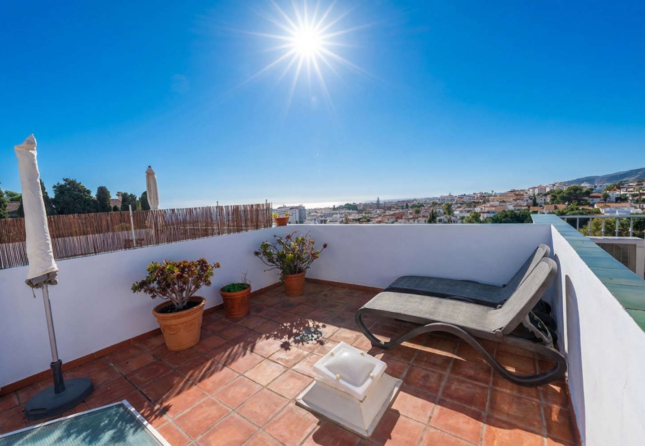 Private rooftop terrace with BBQ and panoramic views on a sunny day in Nerja.