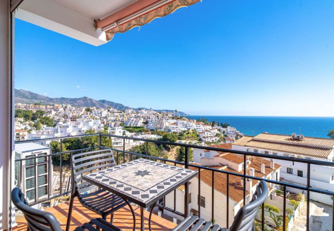 Sea and mountain view terrace at Miami Building Nerja holiday rental