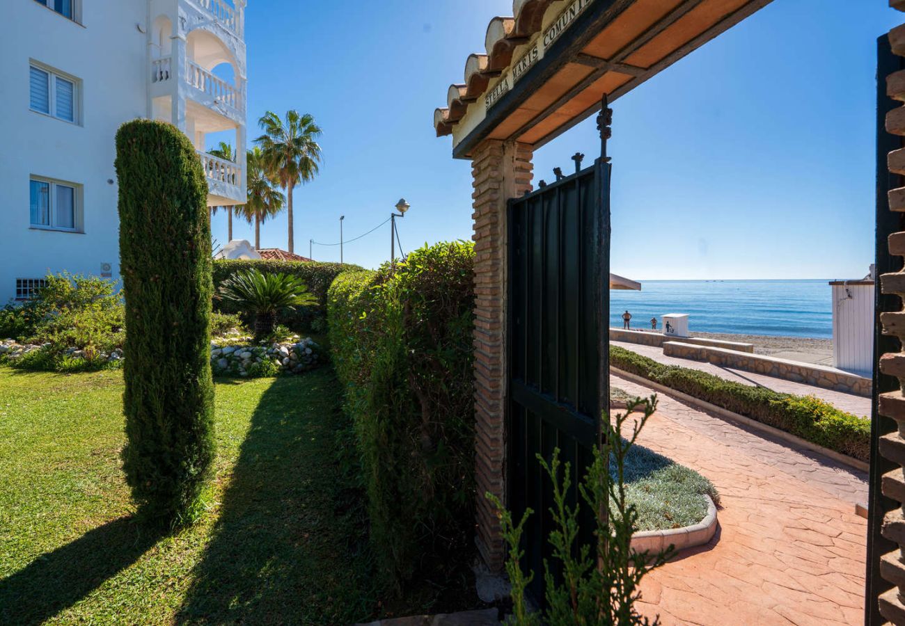 Direct beach access gate from the Stella Maris frontline apartment gardens