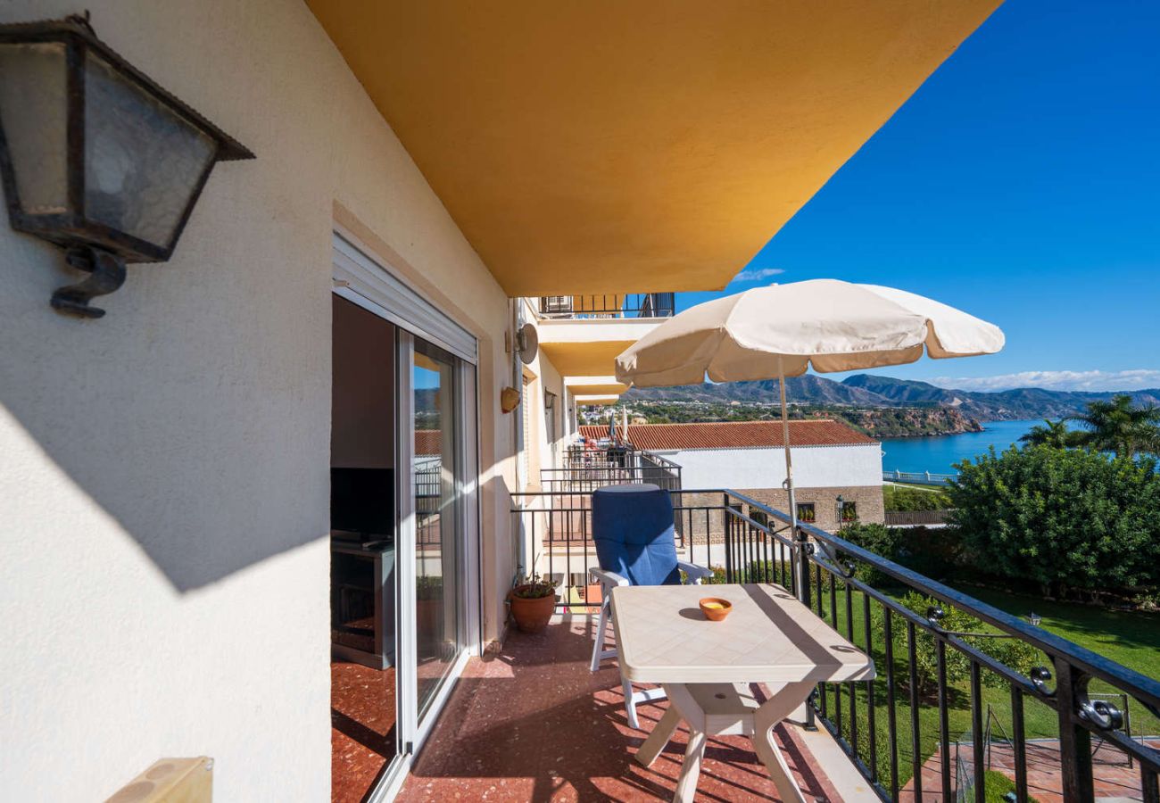 Outdoor area of the flat with table and panoramic views