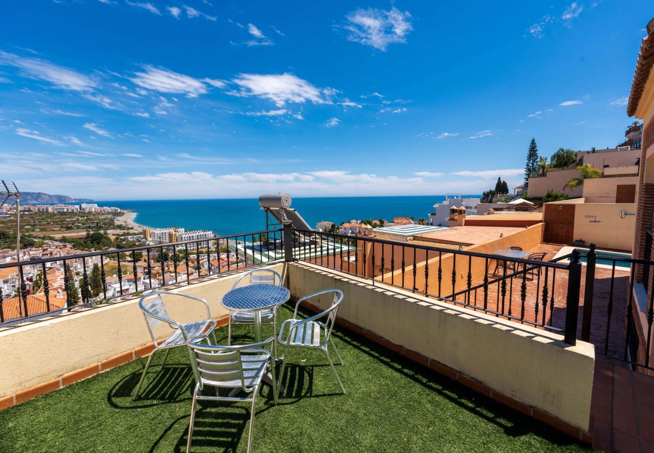 Terrace with dining table and panoramic sea views at Villa Punta Lara 15, Nerja
