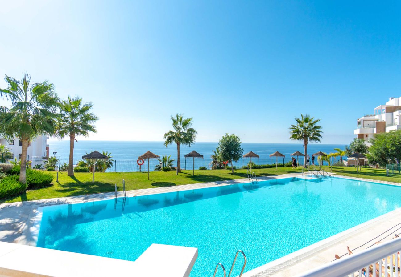 Communal swimming pool with sea views in the Isea Calaceite residential development, Torrox Costa