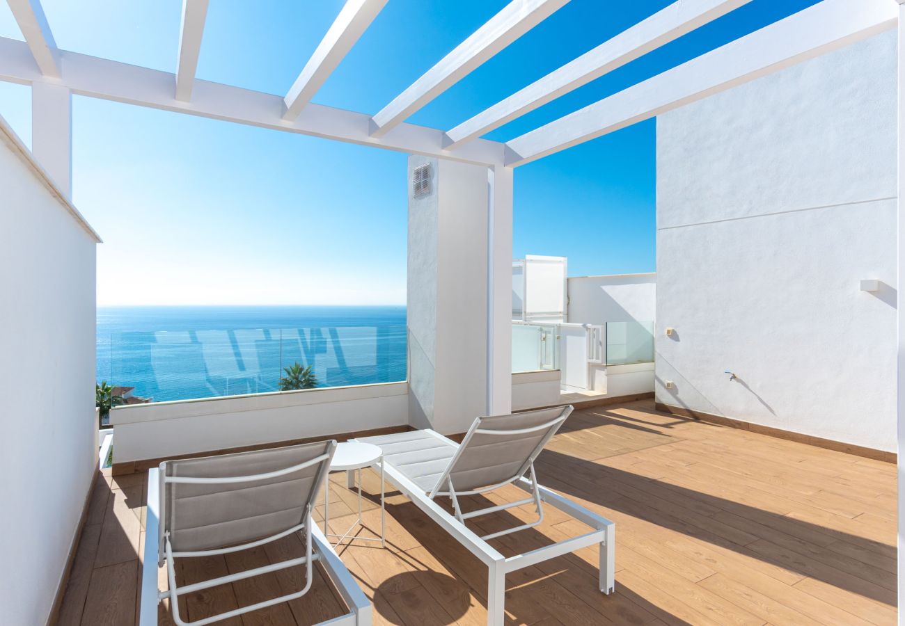 Private sun terrace with sun loungers and panoramic sea views in Isea Calaceite